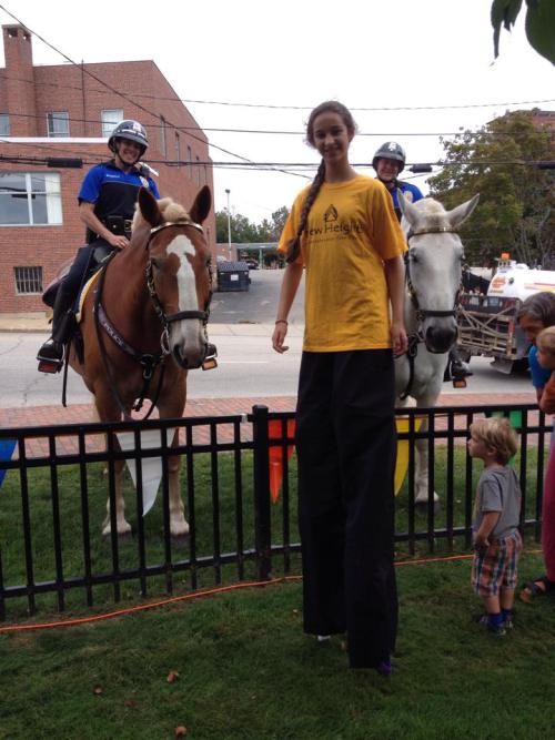 New Heights stilt walkers meet CJ and Monty of Dover's Mounted Patrol